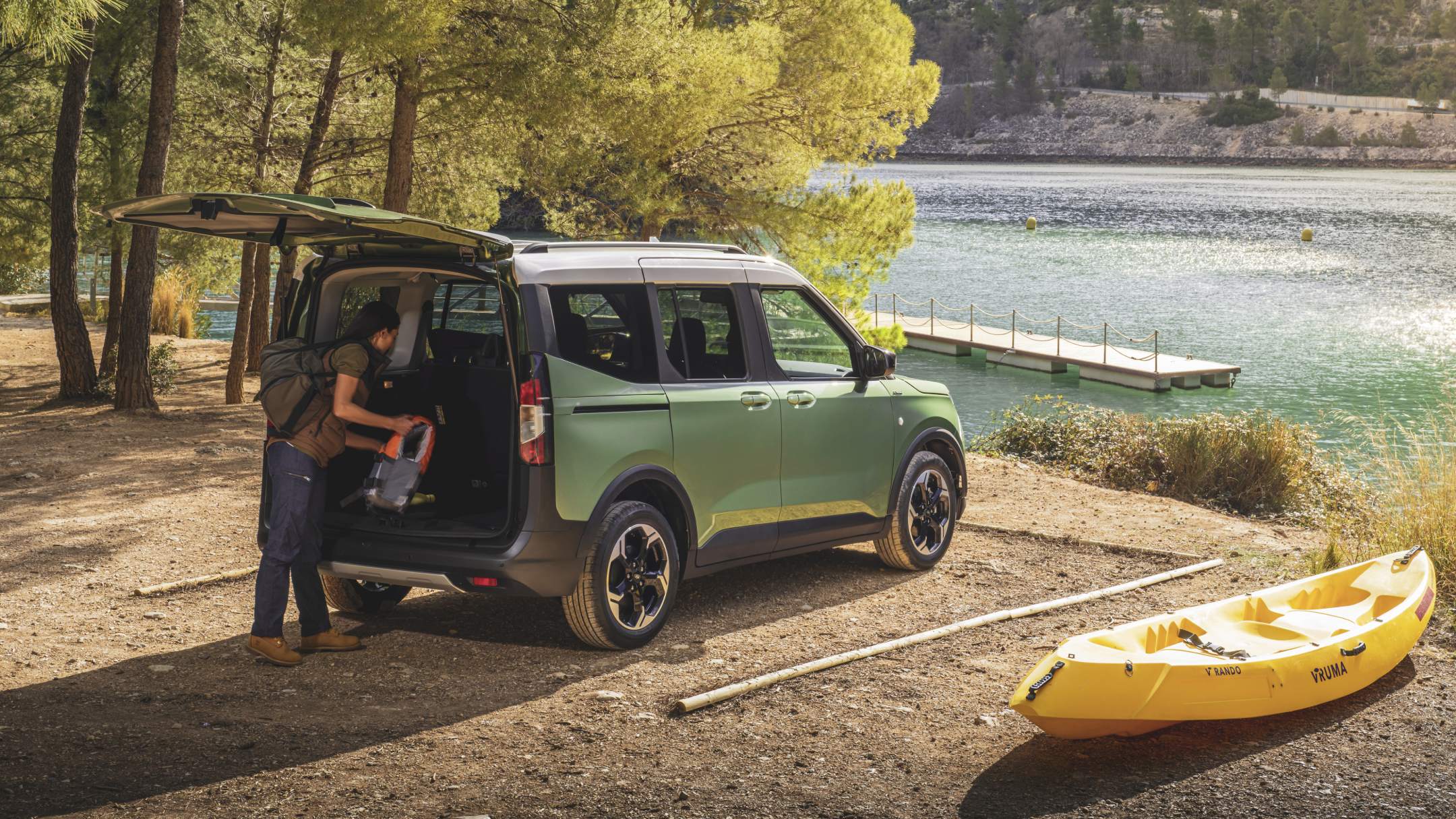 Ford Tourneo Courier Active in Green parked near lake with trunk open